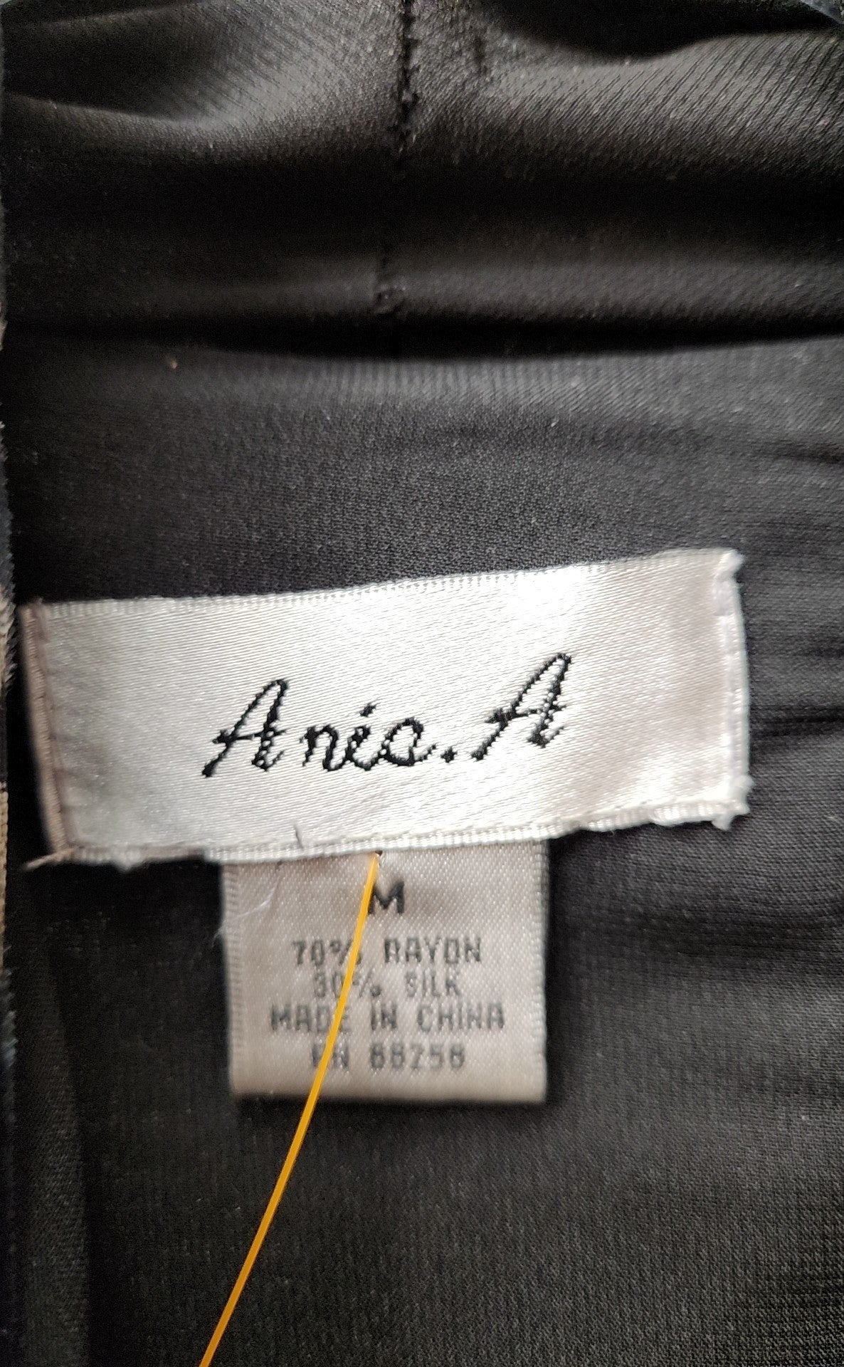 Aris. A Women's Size M Black Cardigan